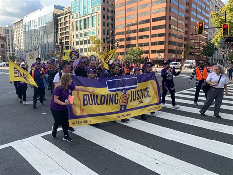 DC-area office building custodians call for better wages with march through DC